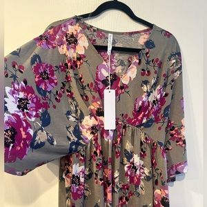 dear Scarlett top . Size M. Never worn. Lots of stretch and comfort.Wrinkle free